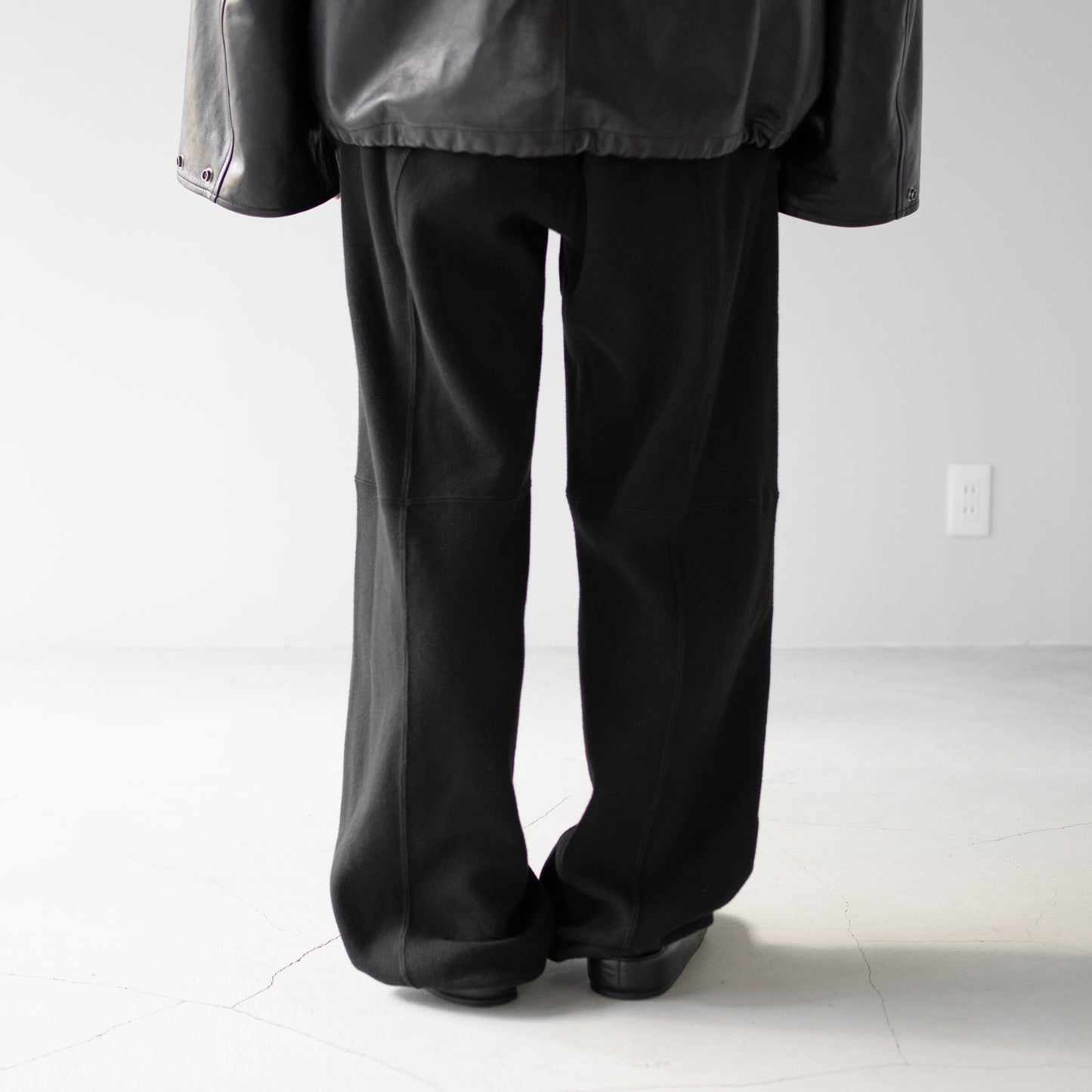 ANCELLM / SWITCHING SMOOTH KNIT PANTS "BLACK"