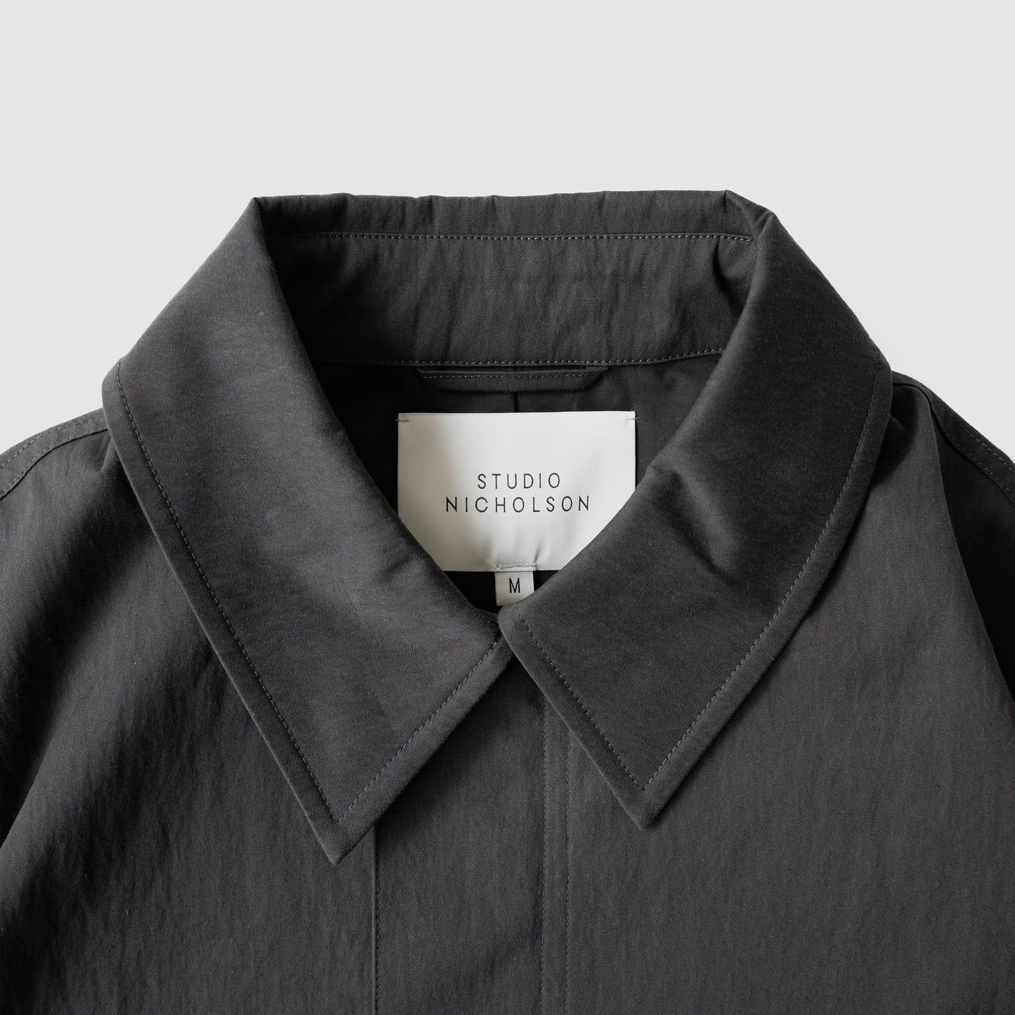 STUDIO NICHOLSON/ SHORT ANORAK JACKET "COAL"