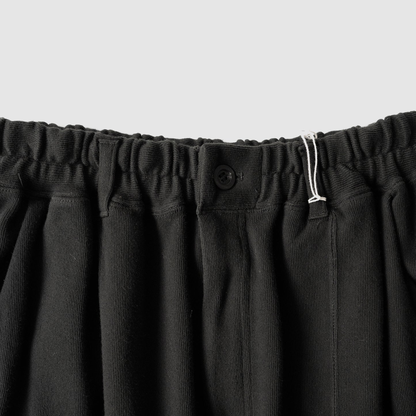 ANCELLM / SWITCHING SMOOTH KNIT PANTS "BLACK"