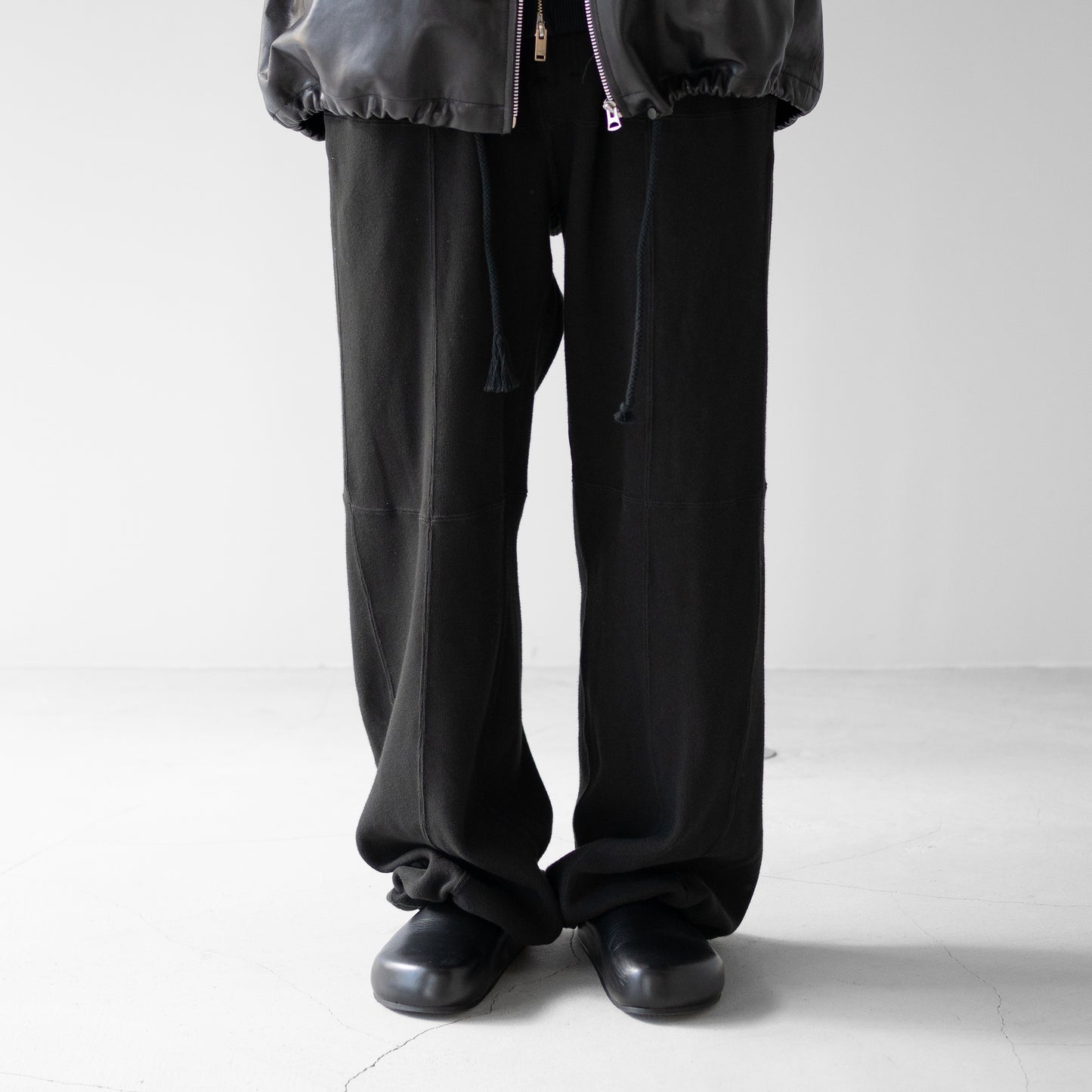 ANCELLM / SWITCHING SMOOTH KNIT PANTS "BLACK"